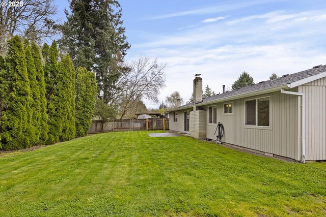 6253 SW 204th Pl, Beaverton, OR 97078 - rear view of house with a chimney and a patio