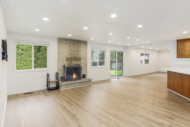 6253 SW 204th Pl, Beaverton, OR 97078 - detailed view of wood finished floors, recessed lighting, a fireplace, and a textured ceiling