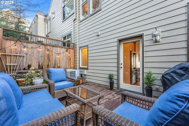 view of patio / terrace featuring fence, an outdoor hangout area, area for grilling, and a wooden deck