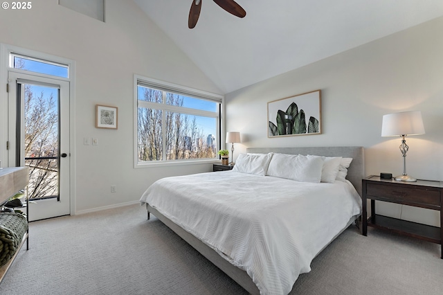 bedroom featuring high vaulted ceiling, light colored carpet, baseboards, and multiple windows