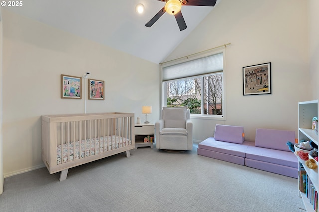 carpeted bedroom featuring high vaulted ceiling, a ceiling fan, and baseboards