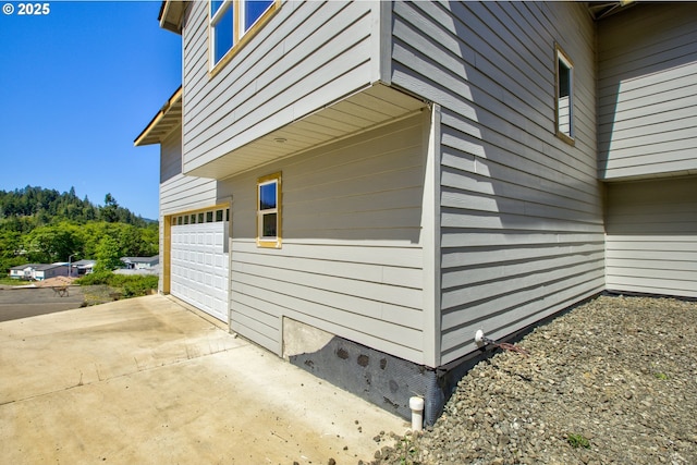 1030 Forest Heights St, Sutherlin, OR 97479 - view of property exterior with a garage and concrete driveway
