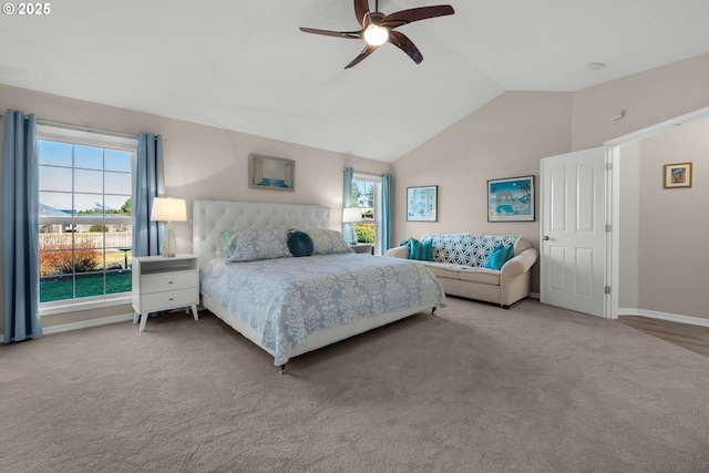 carpeted bedroom featuring ceiling fan and lofted ceiling