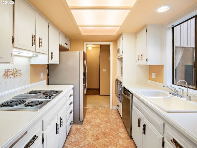 kitchen featuring sink, white cabinetry, tasteful backsplash, electric stovetop, and dishwasher