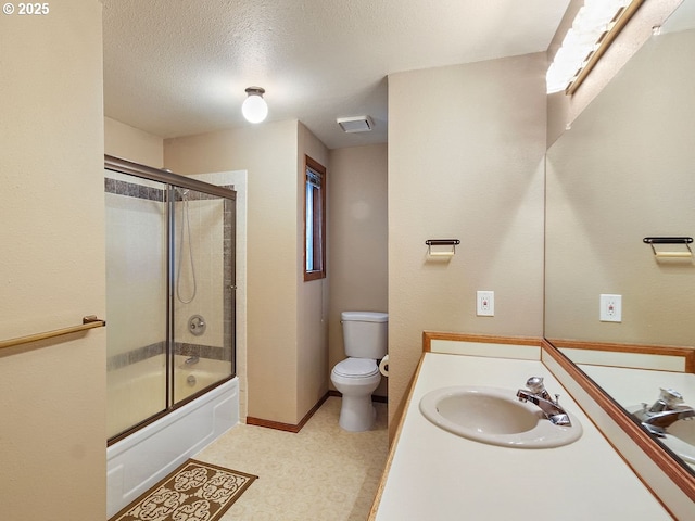 full bathroom with vanity, a textured ceiling, shower / bath combination with glass door, and toilet