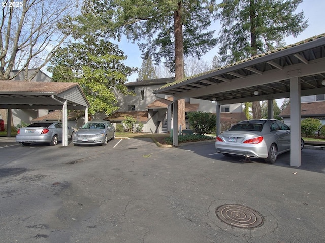 view of vehicle parking with a carport