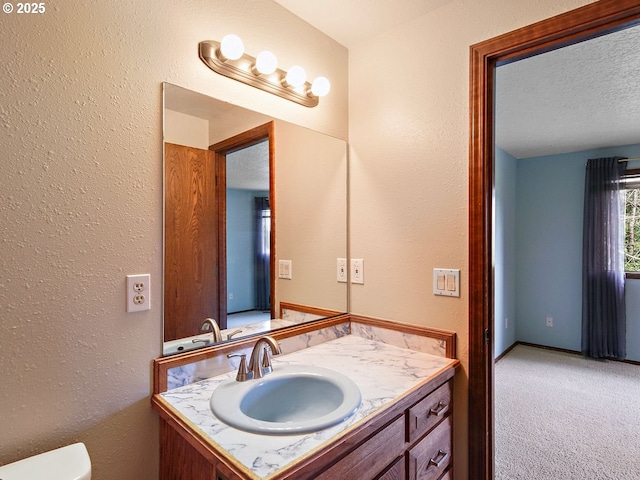 bathroom featuring vanity and a textured ceiling