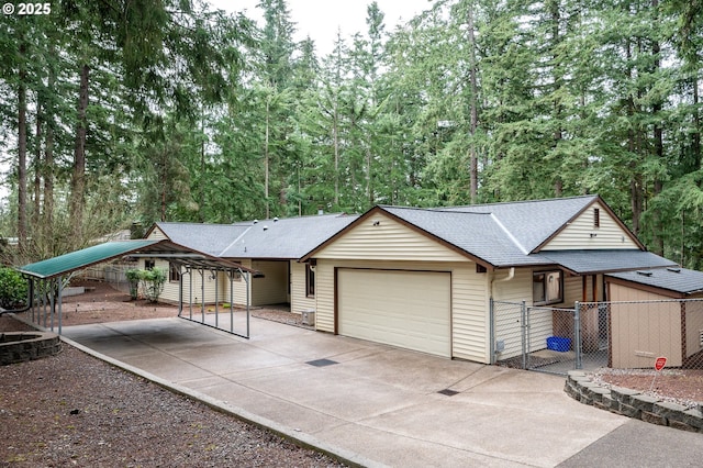 view of front of home with fence, a shingled roof, a garage, a carport, and driveway