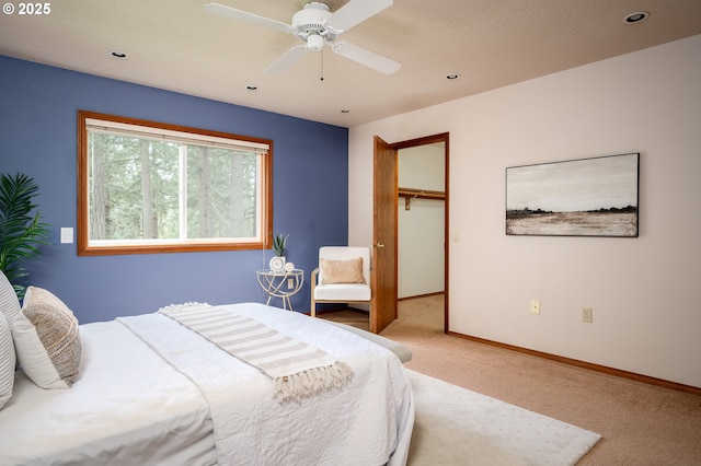 carpeted bedroom with baseboards, recessed lighting, a ceiling fan, and a closet