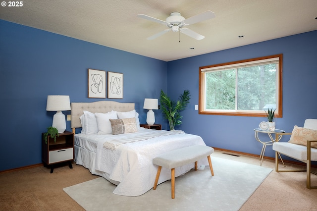 bedroom featuring baseboards, carpet, and visible vents