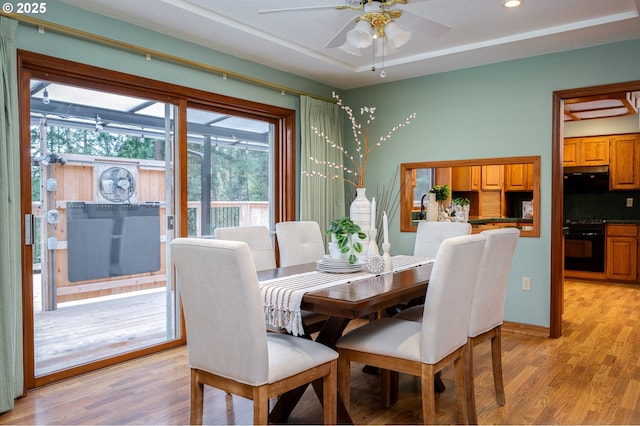 dining area with light wood-style floors, baseboards, a ceiling fan, and recessed lighting