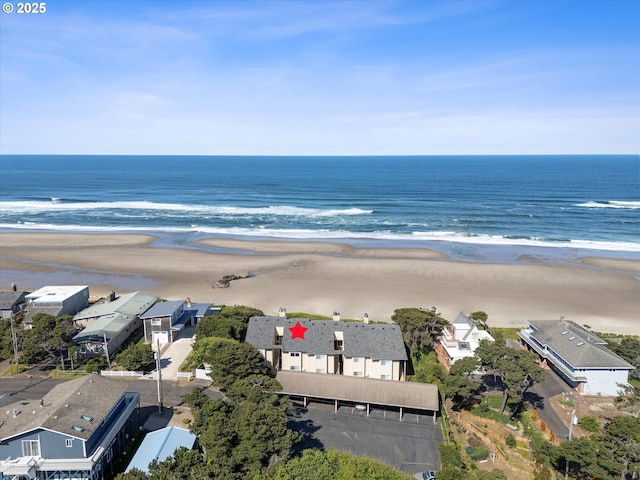 aerial view featuring a water view, a residential view, and a view of the beach