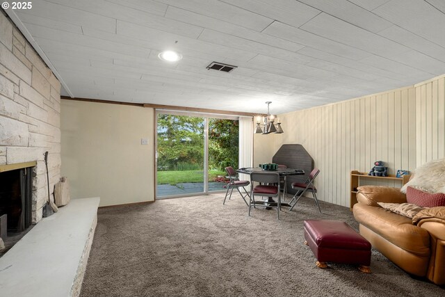 16020 SE Monner Rd, Happy Valley, OR 97086 - living area featuring carpet, a chandelier, a stone fireplace, a desk, and ornamental molding