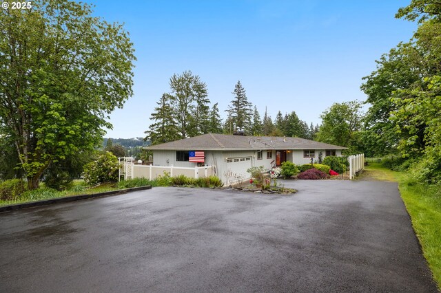 16020 SE Monner Rd, Happy Valley, OR 97086 - single story home featuring asphalt driveway and an attached garage
