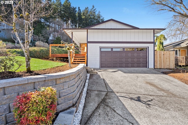 exterior space with driveway and fence