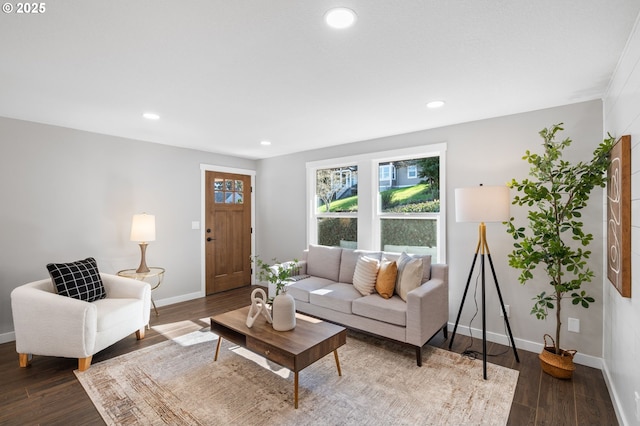 living room featuring recessed lighting, baseboards, and wood finished floors