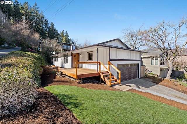 exterior space featuring driveway, board and batten siding, and a front yard