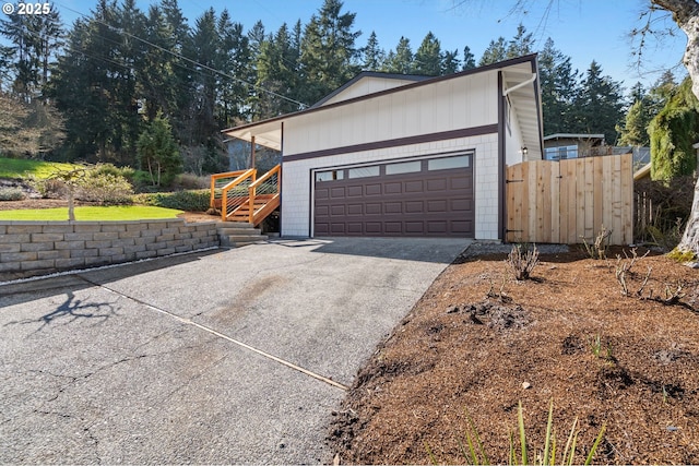 exterior space with concrete driveway