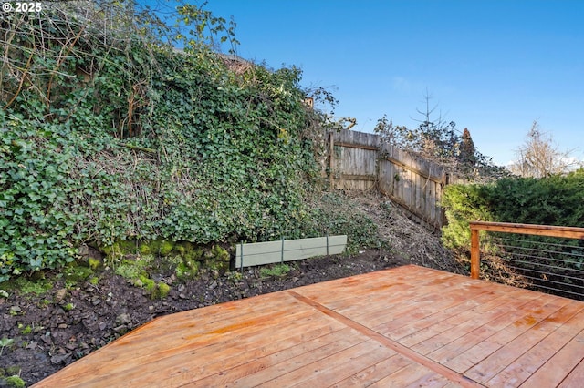 wooden deck featuring fence