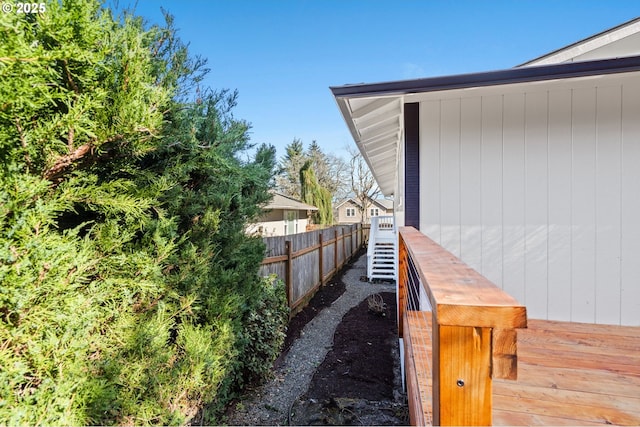 view of home's exterior featuring fence