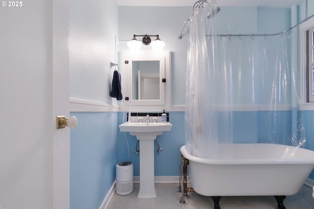 1811 NW Couch St Unit 210, Portland, OR 97209 - full bathroom featuring baseboards and tile patterned flooring