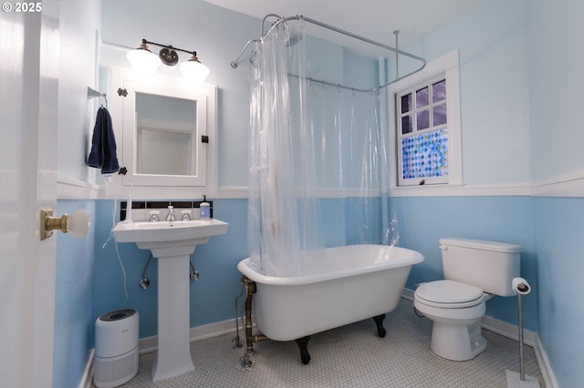 1811 NW Couch St Unit 210, Portland, OR 97209 - full bath with a soaking tub, a shower with shower curtain, and tile patterned floors