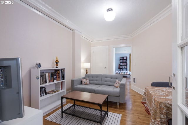 1811 NW Couch St Unit 210, Portland, OR 97209 - living room with ornamental molding and light wood-style floors