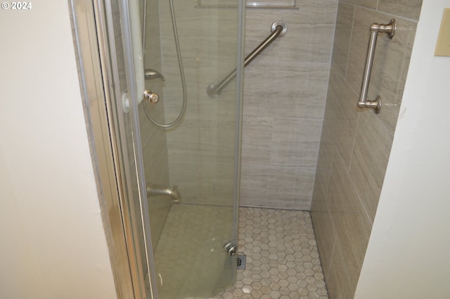 bathroom with a shower stall