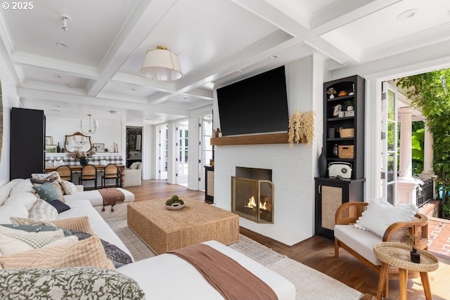 11175 S Riverwood Rd, Portland, OR 97219 - living area featuring coffered ceiling, beamed ceiling, wood finished floors, a brick fireplace, and crown molding