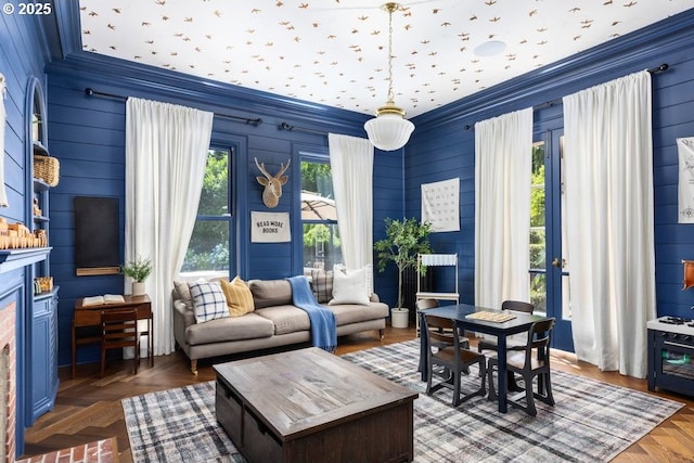 11175 S Riverwood Rd, Portland, OR 97219 - living area featuring ornamental molding, a fireplace, and wood walls