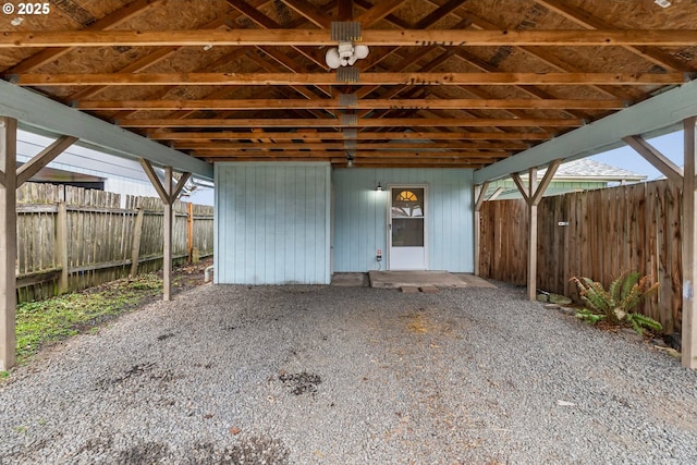 view of patio / terrace featuring a carport and fence