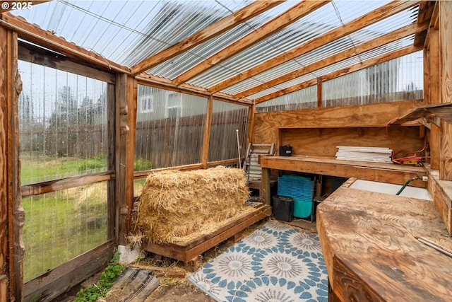 sunroom / solarium with lofted ceiling