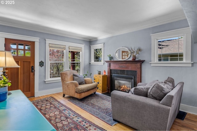 414 NW Riverside Blvd, Bend, OR 97703 - living area featuring healthy amount of natural light, a high end fireplace, wood finished floors, and crown molding