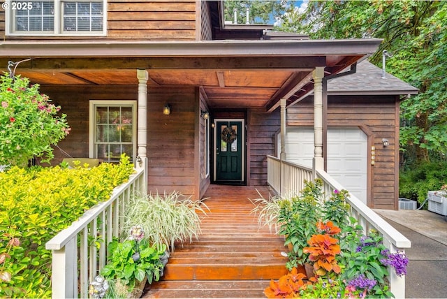property entrance with a porch and a garage