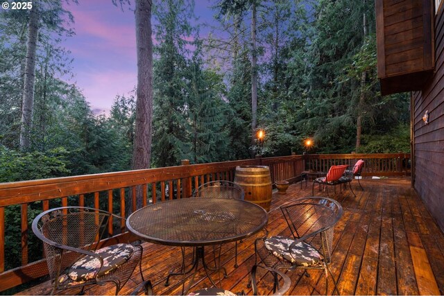 wooden deck featuring outdoor dining area