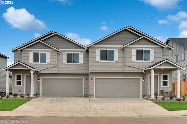 1021 Sommerville Loop, Harrisburg, OR 97446 - view of front of property featuring an attached garage and driveway
