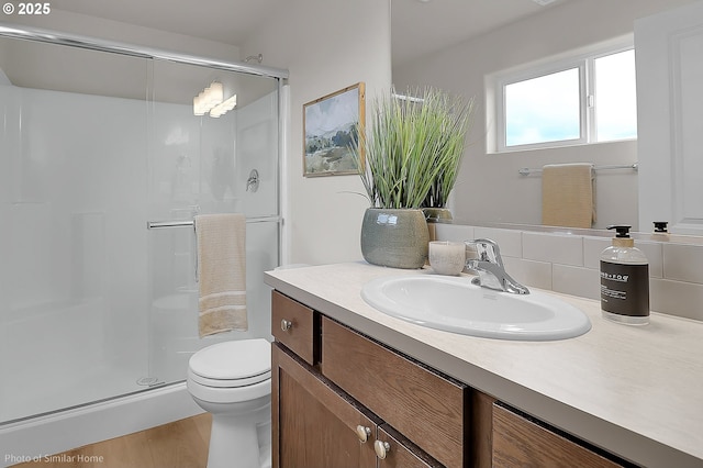 1021 Sommerville Loop, Harrisburg, OR 97446 - full bathroom featuring a shower stall, vanity, and toilet