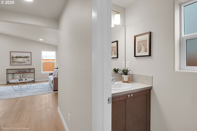 1021 Sommerville Loop, Harrisburg, OR 97446 - bathroom with vanity, wood finished floors, and baseboards