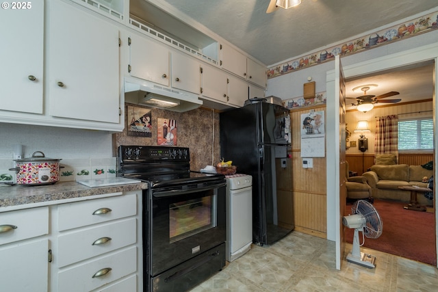 860 Adams St, Eugene, OR 97402 - kitchen featuring black appliances, under cabinet range hood, white cabinetry, light flooring, and decorative backsplash