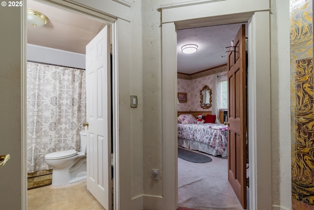 860 Adams St, Eugene, OR 97402 - ensuite bathroom featuring toilet, ornamental molding, and tile patterned floors