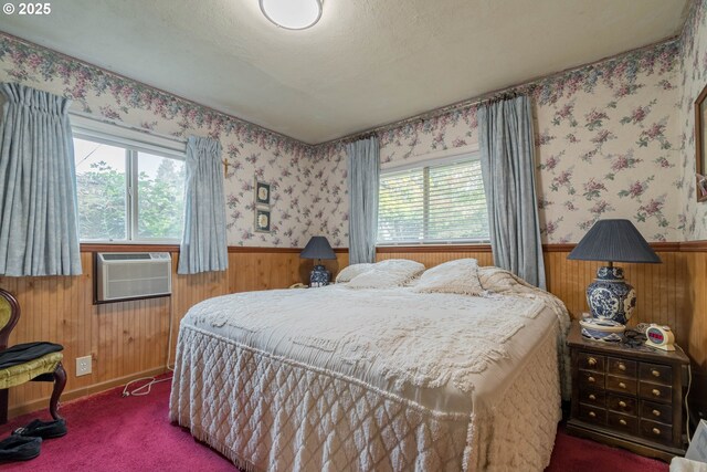 860 Adams St, Eugene, OR 97402 - carpeted bedroom featuring wooden walls, multiple windows, wainscoting, and a wall mounted air conditioner