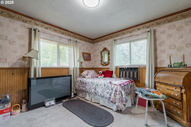 860 Adams St, Eugene, OR 97402 - carpeted bedroom featuring wallpapered walls, wainscoting, multiple windows, wooden walls, and ornamental molding