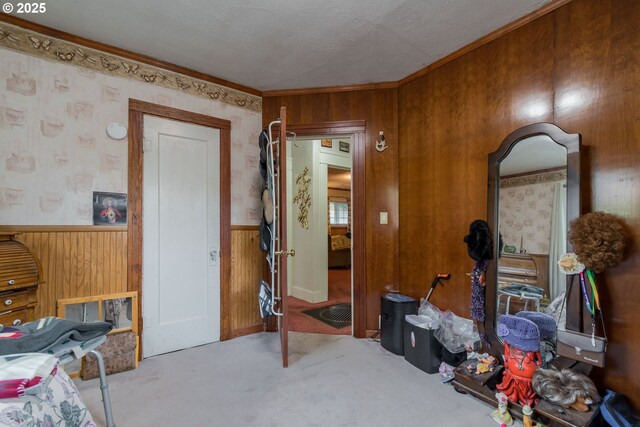 860 Adams St, Eugene, OR 97402 - interior space featuring carpet, wooden walls, a wainscoted wall, and crown molding