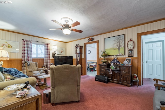 860 Adams St, Eugene, OR 97402 - living room featuring crown molding, carpet floors, wood walls, ceiling fan, and wainscoting