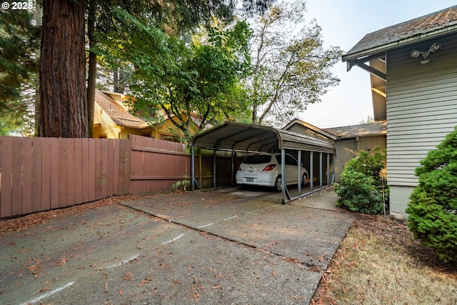 860 Adams St, Eugene, OR 97402 - view of car parking featuring a carport and concrete driveway