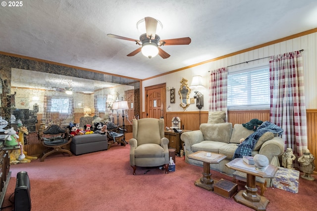 860 Adams St, Eugene, OR 97402 - carpeted living area featuring ornamental molding, plenty of natural light, ceiling fan, wooden walls, and a wainscoted wall