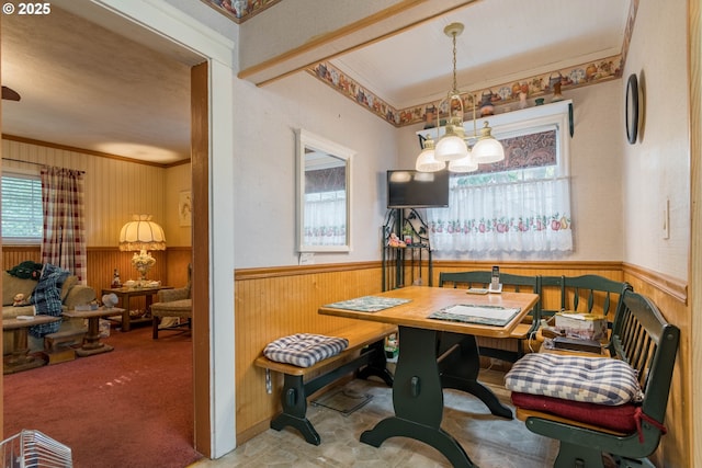860 Adams St, Eugene, OR 97402 - dining area featuring a wainscoted wall, wooden walls, a chandelier, and ornamental molding