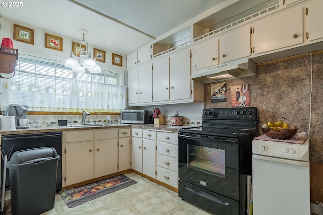 860 Adams St, Eugene, OR 97402 - kitchen with black / electric stove, stainless steel microwave, under cabinet range hood, a sink, and a chandelier