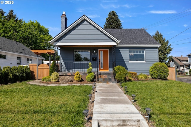 6959 N Denver Ave, Portland, OR 97217 - bungalow-style house featuring covered porch, a chimney, and a shingled roof