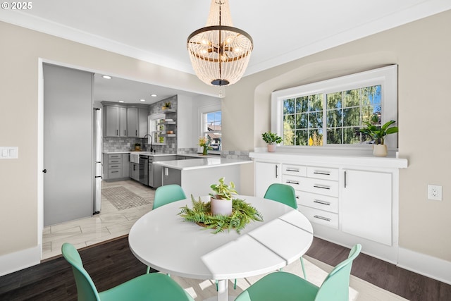 6959 N Denver Ave, Portland, OR 97217 - dining space featuring a chandelier, recessed lighting, and baseboards